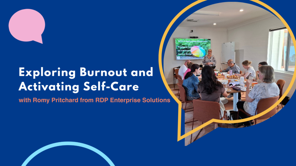 Romy Pritchard facilitating the Exploring Burnout and Activating Self-Care workshop with participants seated around a table.