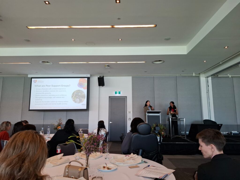Attendees seated at tables during a presentation at the WA Women’s Health Conference 2026